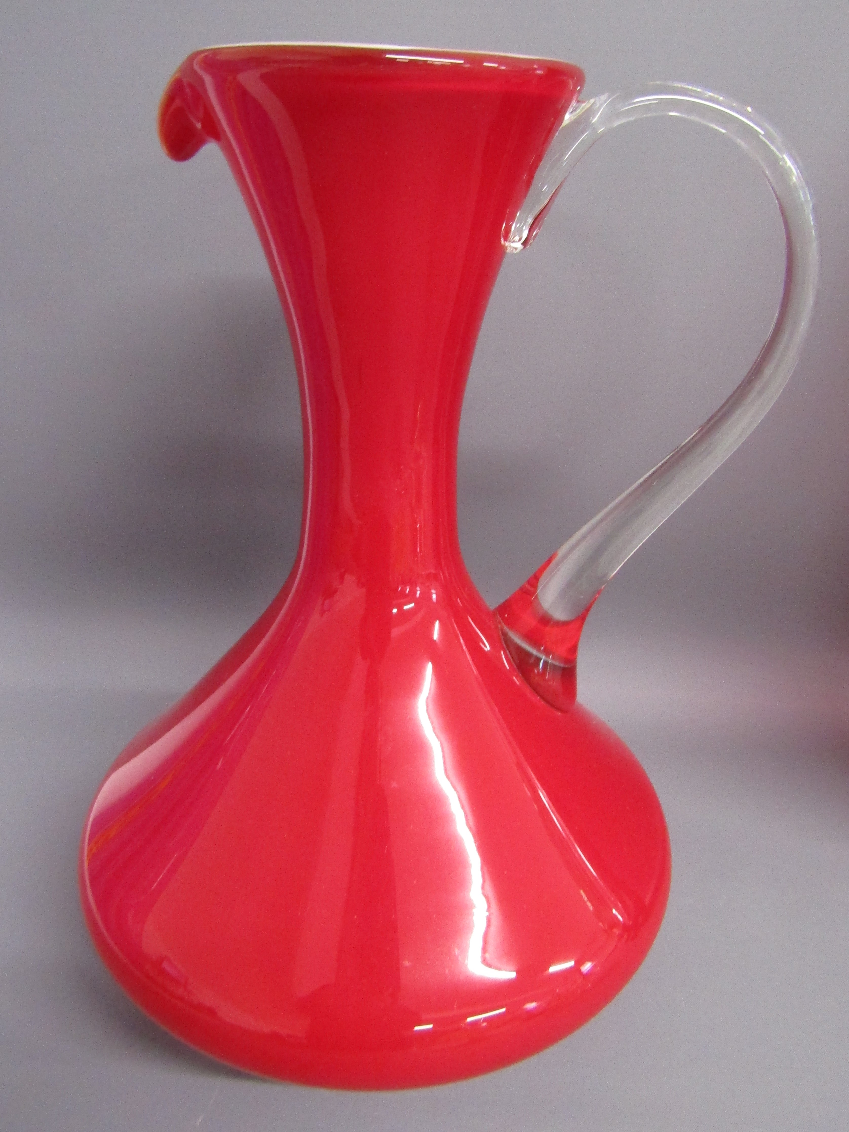 Collection of coloured glass includes over-sized green glass wine glass and purple charger, red jug, - Image 3 of 6