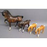 4 Beswick horses - 1549 prancing stallion, 947 foal head down and 2 946 palomino foals with head