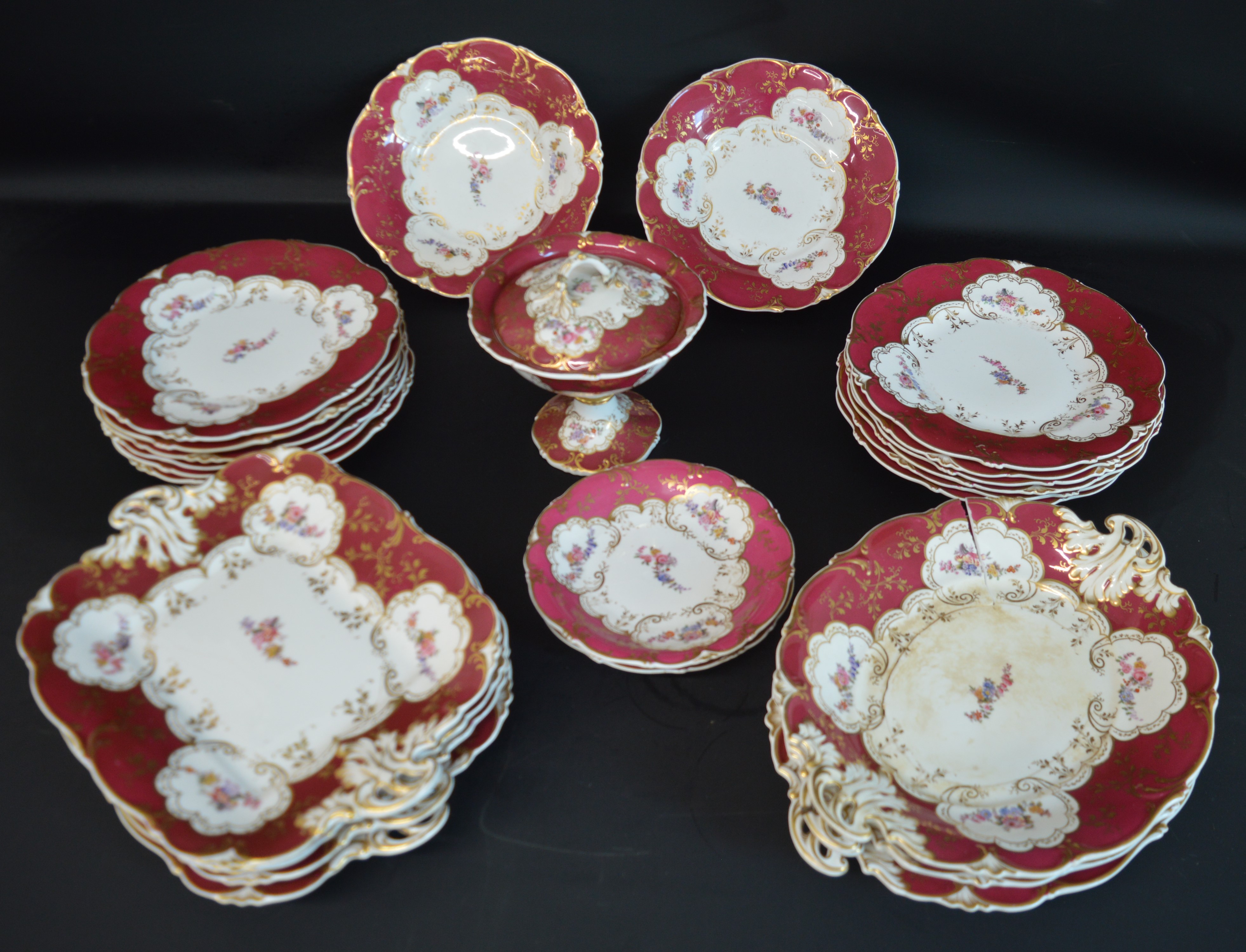 Victorian part dinner service with gilt decoration on burgundy ground