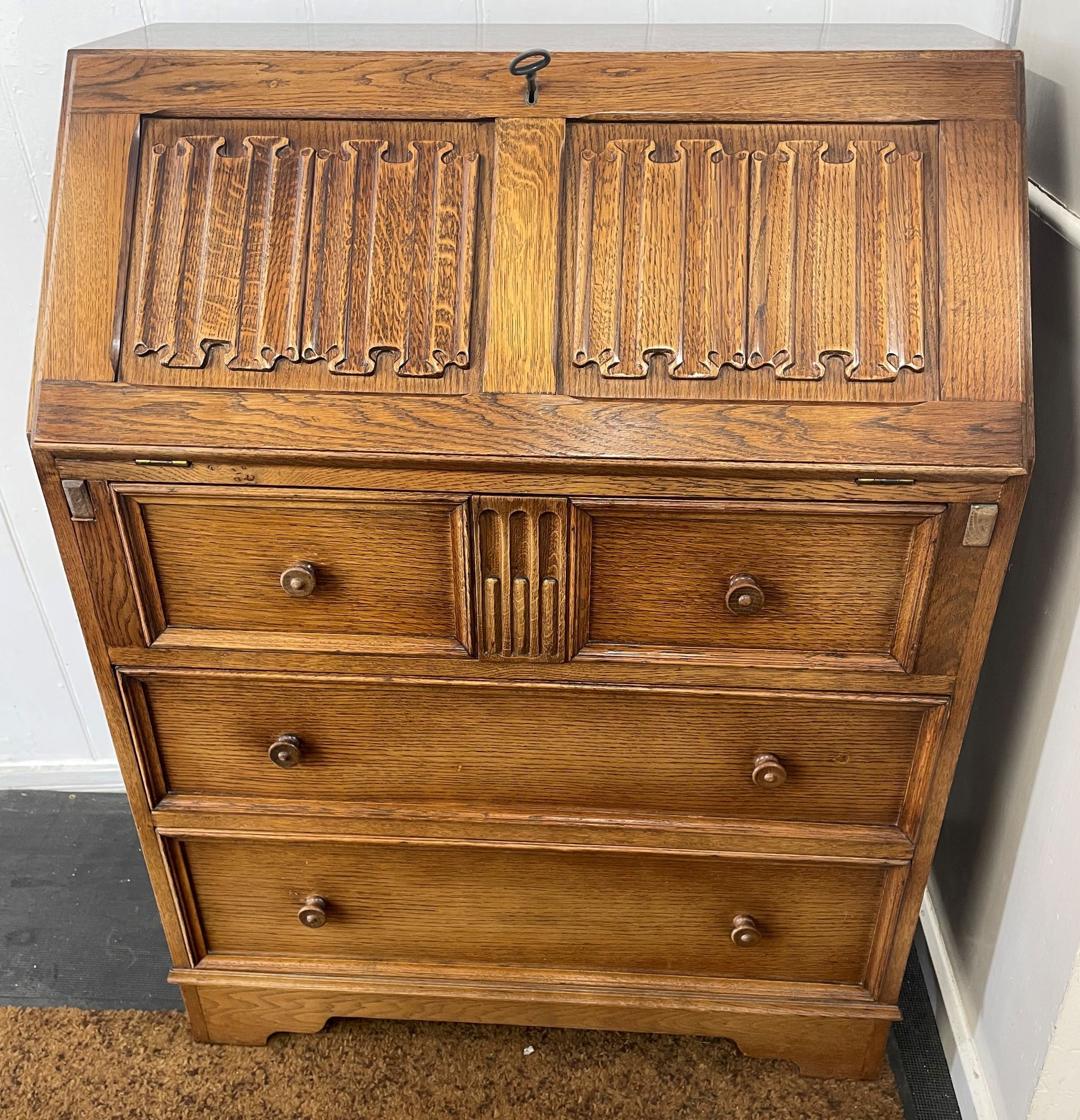 1930's oak bureau with linen fold panels