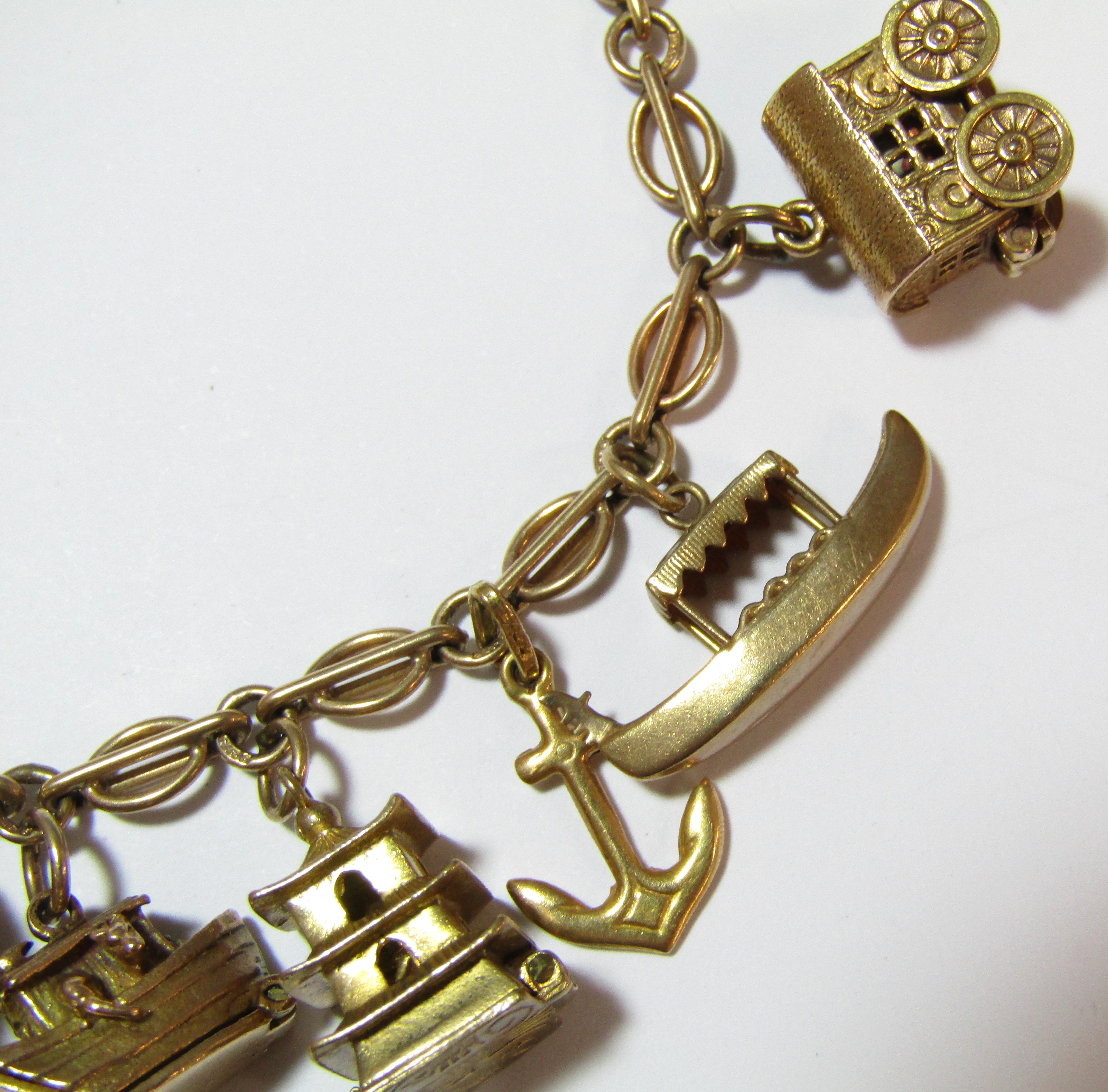 9ct gold charm bracelet - all charms appear hallmarked apart from 'Old Mother Hubbards Boot', - Image 3 of 8