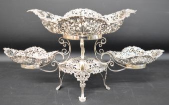 Impressive Victorian/Edwardian silver centrepiece, comprising one large and two smaller fret cut