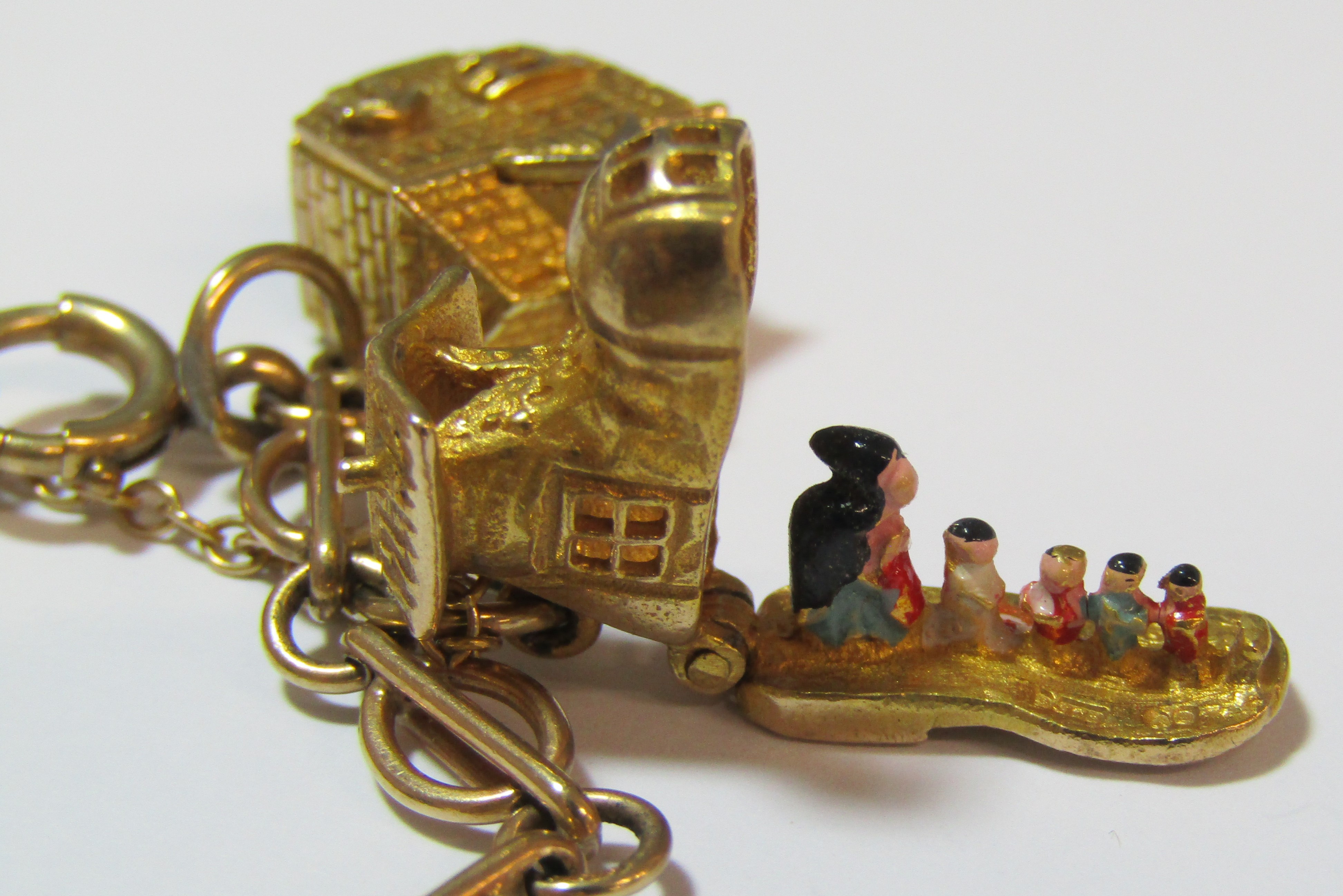 9ct gold charm bracelet - all charms appear hallmarked apart from 'Old Mother Hubbards Boot', - Image 6 of 8
