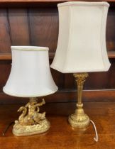Gilt plaster table lamp in the form of a boy riding a swan & a gilded metal column table lamp