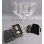 6 Dom Perignon champagne flutes and 2 Dom Perignon bottle stoppers