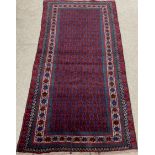 Rich blue ground Afghan Baluchi nomadic rug with all over design 200cm by 105cm