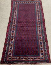 Rich blue ground Afghan Baluchi nomadic rug with all over design 200cm by 105cm