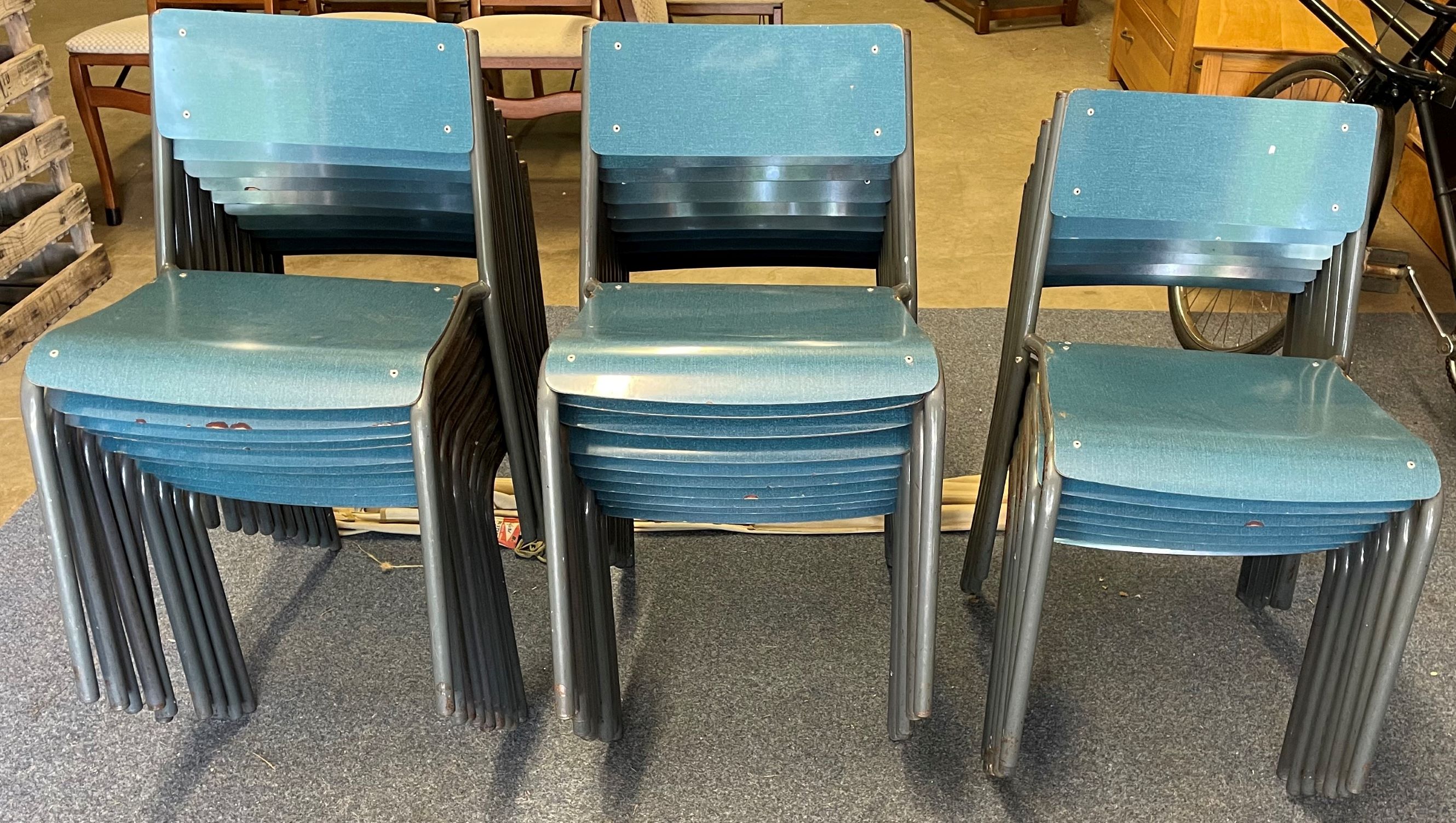 27 vintage metal frame stacking chairs & an old camp bed missing legs