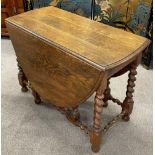 Early 20th century oak gate leg table with barley twist legs 143cm by 106cm Ht 73cm