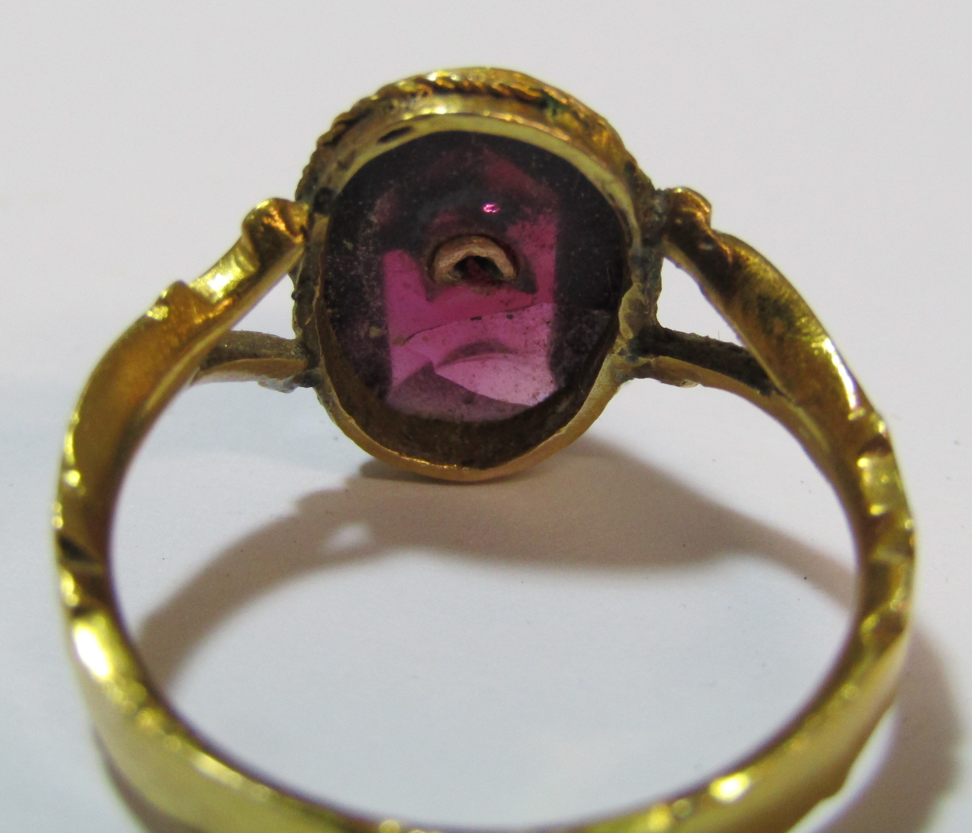 Tested as 18ct gold ring with oval garnet cabochon stone decorated with star design and single - Image 8 of 8