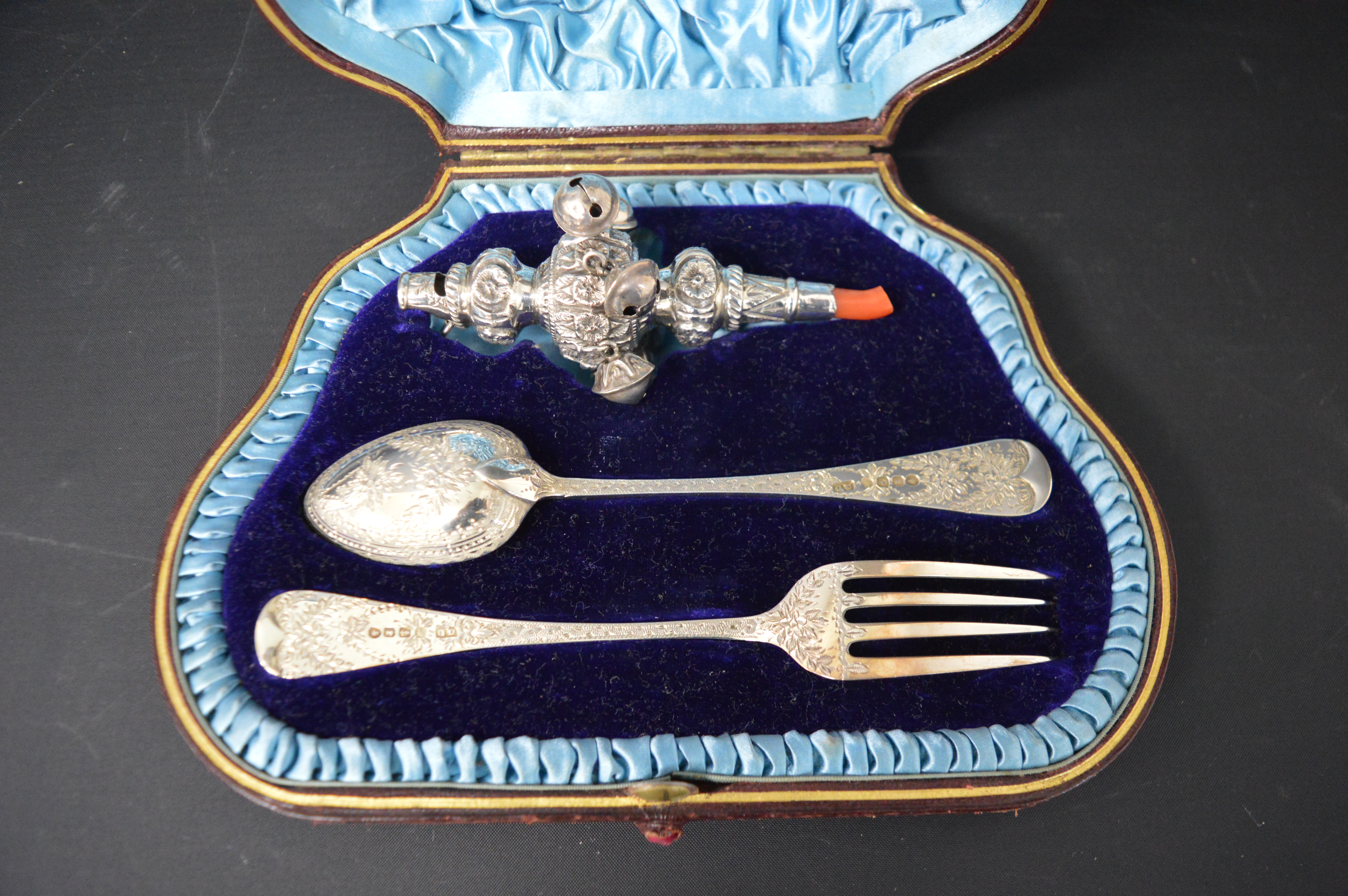 Cased Victorian child's silver rattle, spoon and fork, the cutlery with bright cut engraving and the - Image 2 of 3