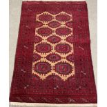 Hand woven Turkman rug with traditional Bokhara design 175cm by 115cm
