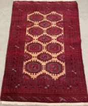 Hand woven Turkman rug with traditional Bokhara design 175cm by 115cm