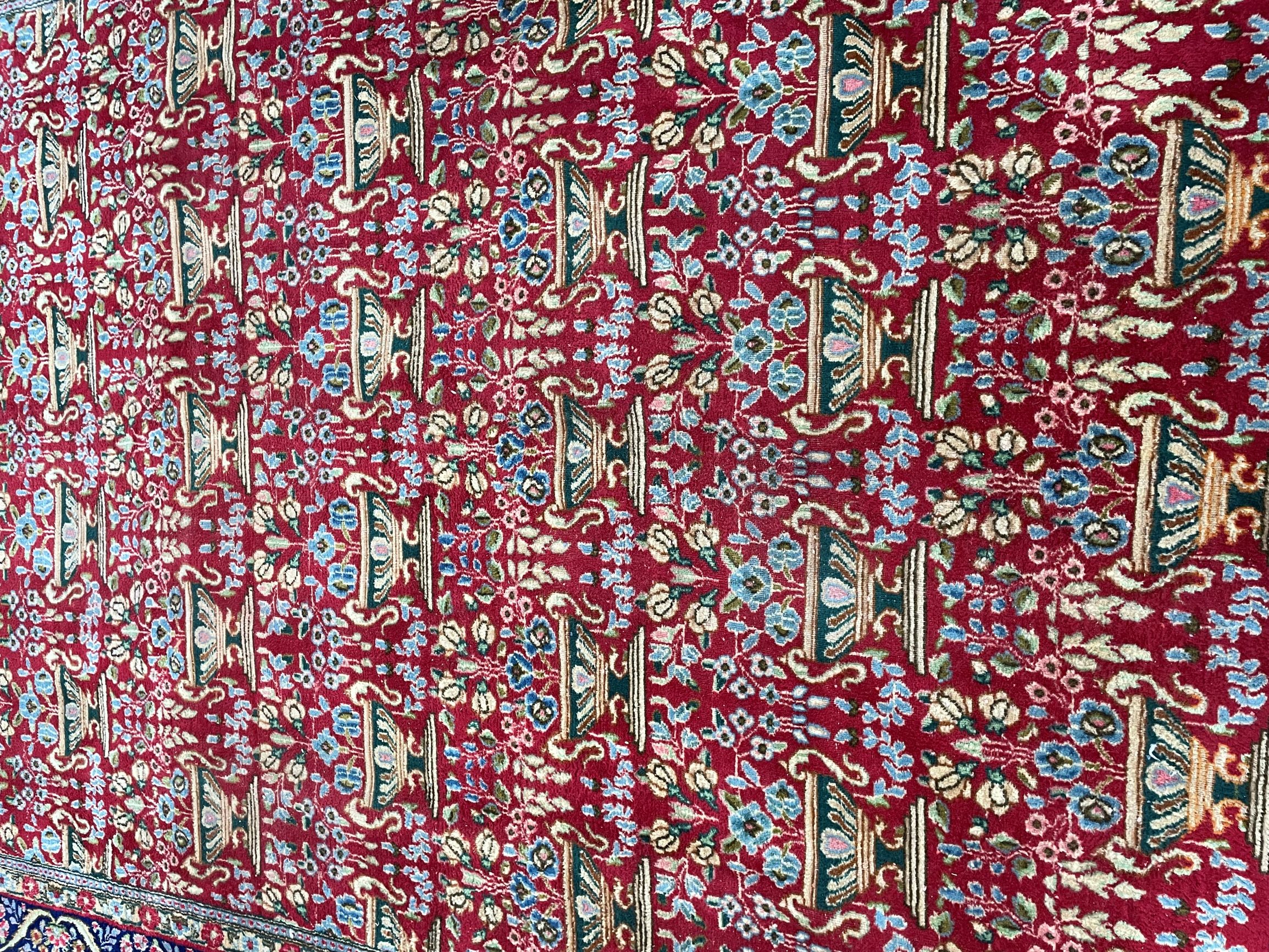 Rich red ground Persian carpet with all over floral design with blue border 330cm by 240cm - Bild 2 aus 3