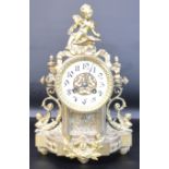 Early 20th century decorative gilt metal mantel clock surmounted by a cherub, 22cm w x 33cm h