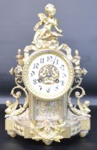 Early 20th century decorative gilt metal mantel clock surmounted by a cherub, 22cm w x 33cm h