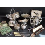 Selection of silver plate including muffin dish, basket, large gravy boat, selection of cutlery