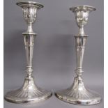 Pair of Hawksworth, Eyre & co, Sheffield 1898 weighted silver candle sticks - approx. 12cm tall