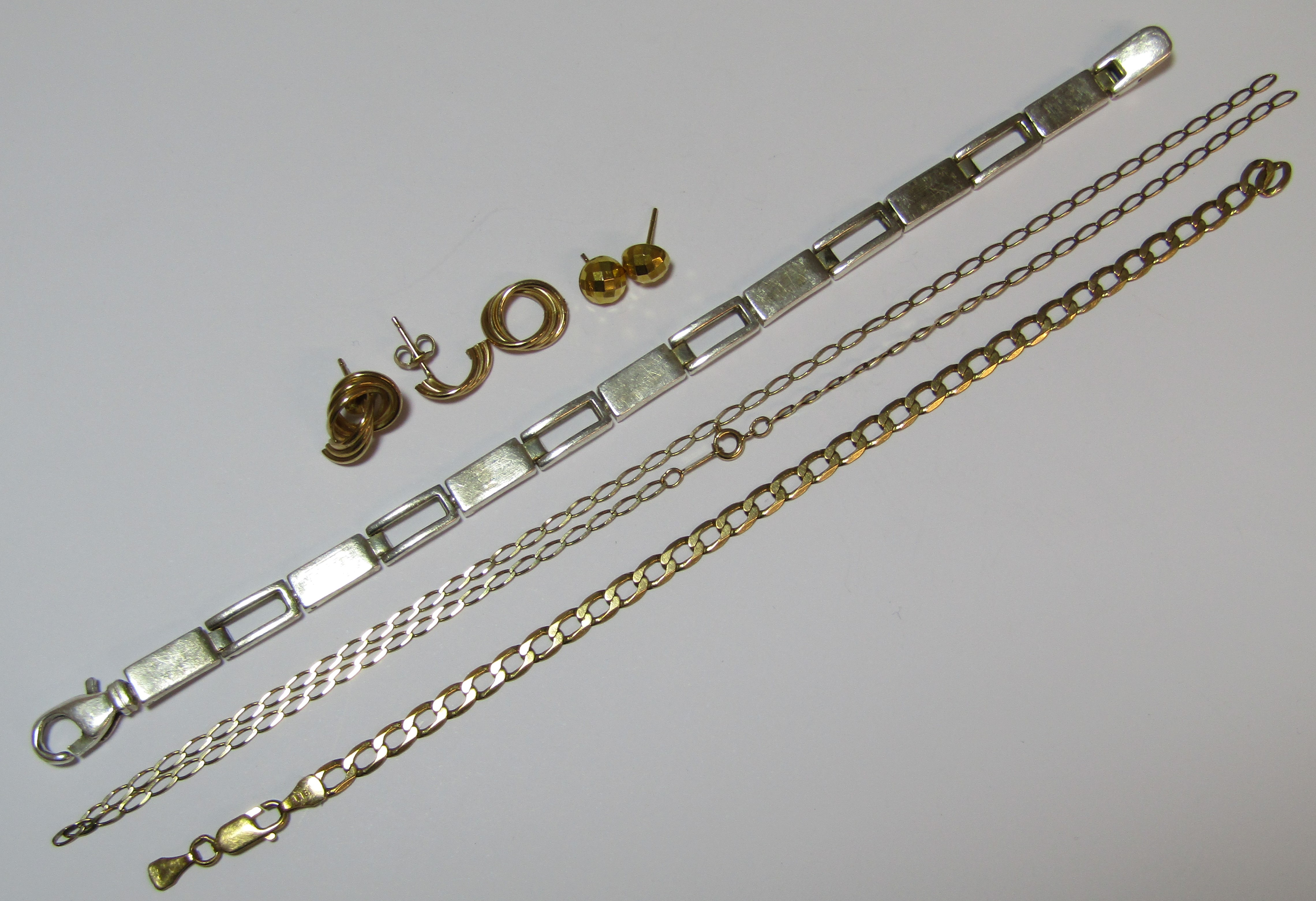 9ct gold necklace, bracelet and earrings 7.8g - all damaged - and a silver bracelet 0.7ozt