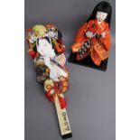 Ichimatsu kimekomi doll on stand and Hagoita paddle