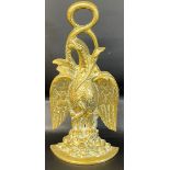 Brass door stop in the form of a phoenix & serpent  Ht. 34cm