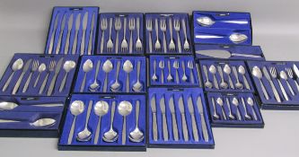 Collection of boxed Oneida 'Venetia' cutlery includes knives, forks, teaspoons, desert spoons,