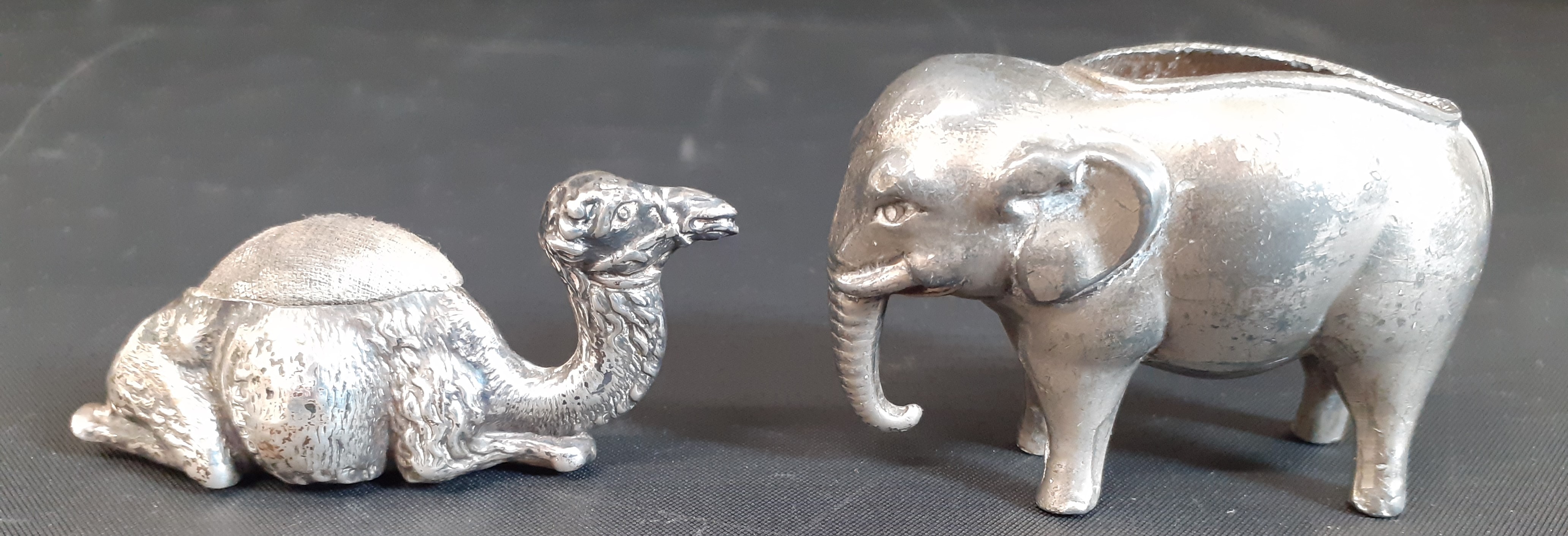 Edwardian novelty silver camel pin cushion, Birmingham 1907, modelled seated, 6.5cm long & white