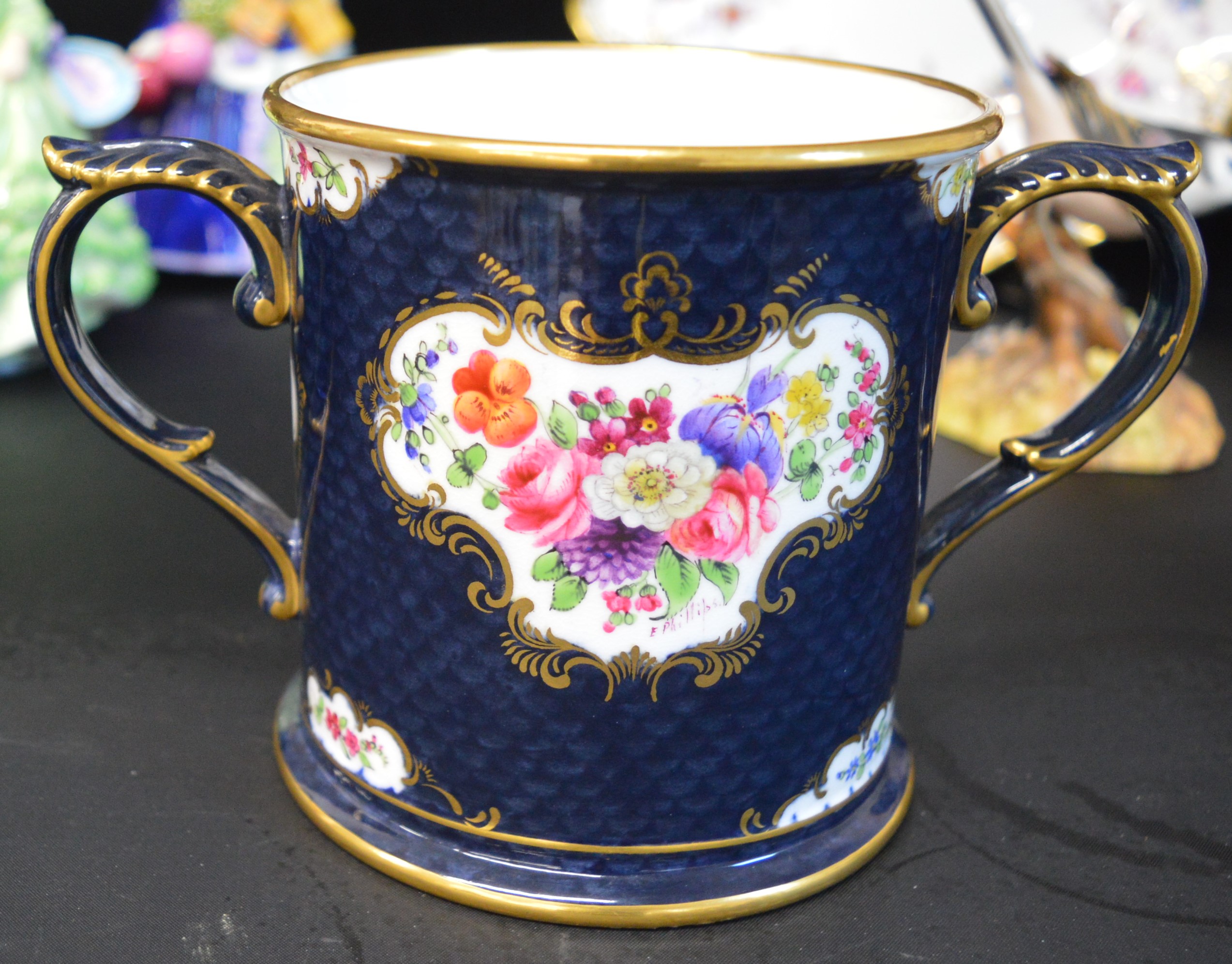 Royal Worcester hand painted loving cup with floral cartouche signed E Philips & dated 1927, 2 Royal - Image 2 of 3