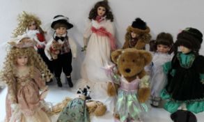 Large collection of modern bisque dolls, most on bases
