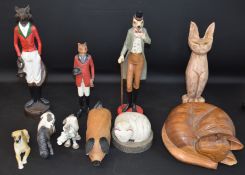 10 wooden / composition animal ornaments including cats, horses, foxes, a dog, a pig and a squirrel