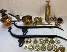 Brassware including keys, pans, oil lamp, pump, ornaments, bowls and horse brasses, horse hames, a