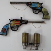 A pair of toy pop guns (in working order), and a pair of opera glasses