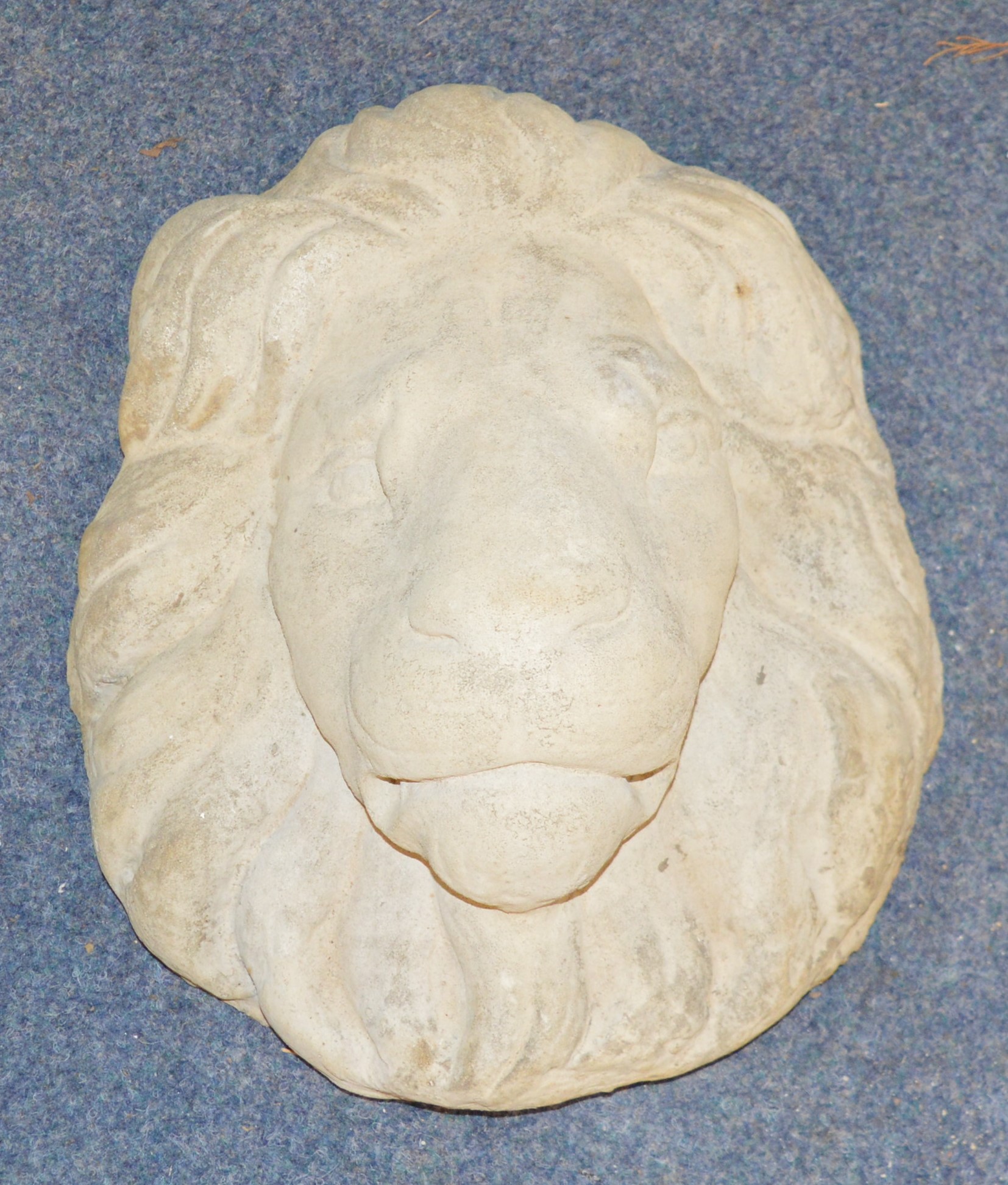 Concrete Lions mask garden feature