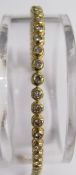 18ct gold rub over tennis bracelet, set with 47 diamonds totaling 2.0ct - length 20cm - total weight