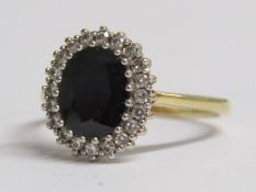 18ct gold DS & Co sapphire and diamond halo ring - central sapphire approx. 9mm x 7mm surrounded