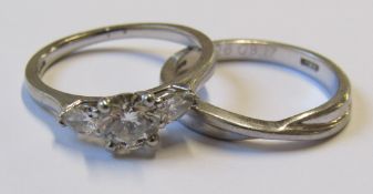 Platinum wedding and engagement rings, round brilliant cut polished diamond, claw set with