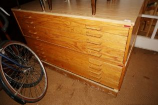 A modern light oak plan chest, fitted ten drawers, on block base, 53" wide x 39" deep x 33" high