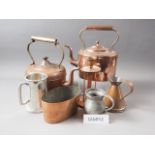 Two copper kettles, a copper jug, a copper jelly mould, four pewter tankards and a pair of bellows