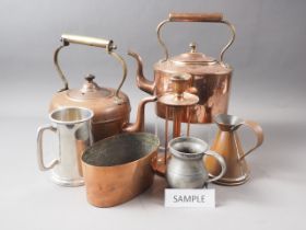 Two copper kettles, a copper jug, a copper jelly mould, four pewter tankards and a pair of bellows