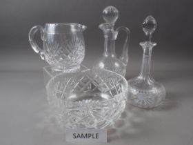 Two cut glass decanters and stoppers, a cut glass claret jug, three cut glass bowls and other cut
