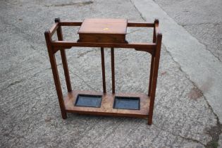 An oak stick stand with glove compartment 24" wide