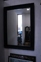 A bevelled plate wall mirror, in beaded ebonised frame, 42" x 30" overall