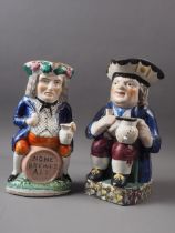 A 19th century Staffordshire landlord "Home Brewed Ale" Toby jug, 9" high, and an early 19th century