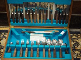 A Grant and Cook 1960s stainless steel and hardwood table canteen, in original case (carving fork,