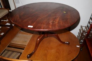 A 19th century mahogany circular topped low occasional table, on tripod splayed supports, 31" dia