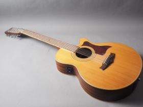 A Tanglewood twelve-string acoustic guitar, model no. TW-145/12-SC, with carry case