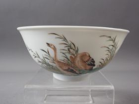 A Chinese porcelain bowl with birds in a landscape and verse decoration, and interior peach
