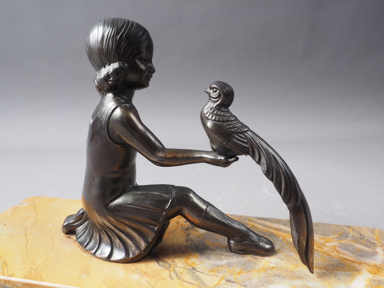 An Art Deco bronzed figure group, girl with bird, on yellow marble base, 11" wide - Image 3 of 3
