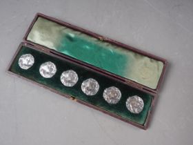 A set of six silver Art Nouveau embossed silver buttons, woman's head design, in case