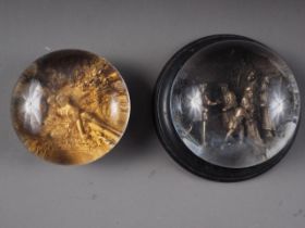 Two mid 19th century "pinchbeck" paperweights, "Sale of Joseph", on marble base, 4 1/2" dia, and "